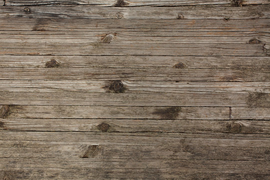 Old gray boards with cracked twigs