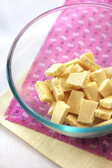 Bar of white chocolate broken into pieces