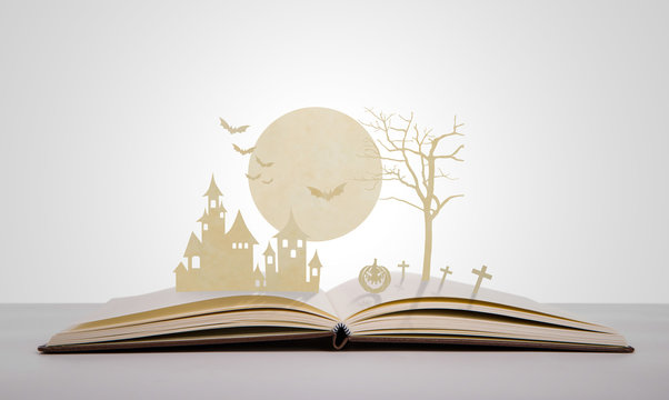 Paper Cut Of Halloween On Old Book