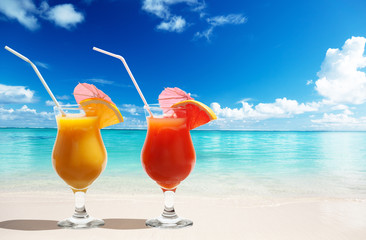 Two fresh juices on beach