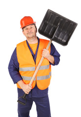 Worker in hard hat holding shovel