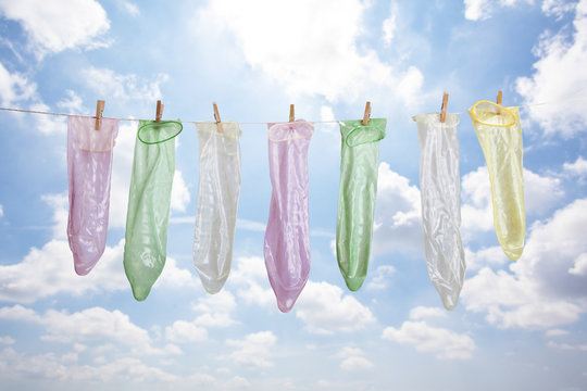 used condoms hanging to dry