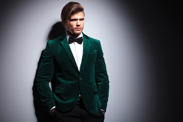 long haired young man in velvet suit and bow tie