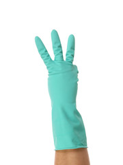 Hand shows three in rubber glove.
