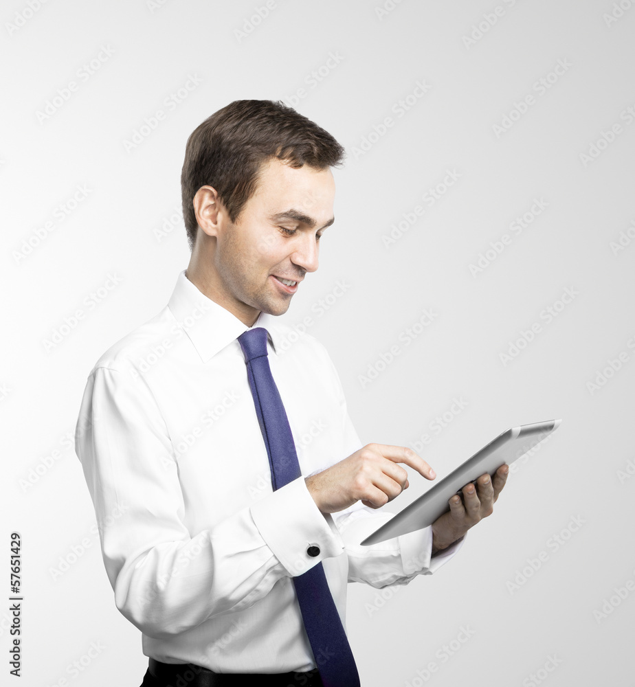 Wall mural businessman holding tablet