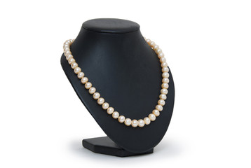 Pearl necklace on black mannequin isolated