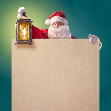 Santa Claus with a lantern and a poster