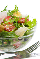 salad from fresh tomatoes, arugula, parmesan, raisin and