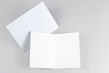 Blank open card and blue envelope