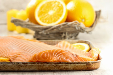 Big raw salmon fillet on wooden table