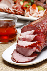 Sliced sausage on wooden table