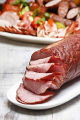 Sliced sausage on wooden table