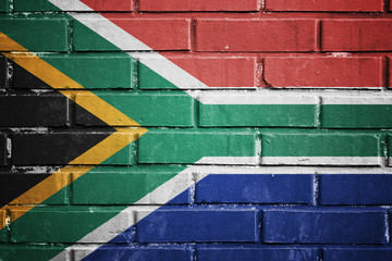 South africa flag on a textured brick wall