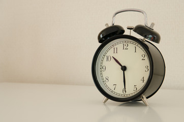 alarm clock watch on vintage background