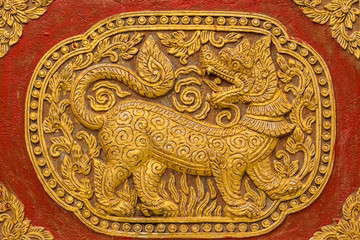 Singha Wall sculpture on Ubosot in Wat Saen Fang , Chiangmai Tha