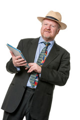 Man on business trip consults tablet computer - on white