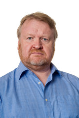 Puzzled middle aged bearded guy in blue shirt - on white