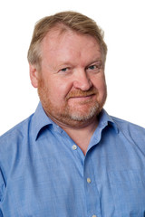 Friendly middle aged bearded guy in blue shirt - on white