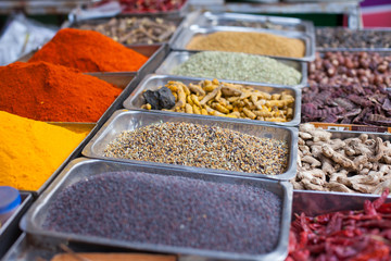 Indian colored spices at local market in Goa, India