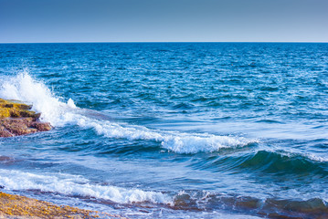 rock and waves in sea