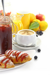 Breakfast with croissants and beverages