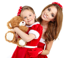 Woman and little girl wearing santa claus costume