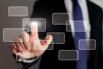 hand pushing a button on a touch screen interface