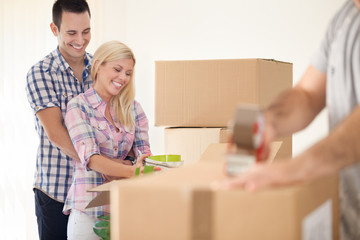 Smiling couple moving house