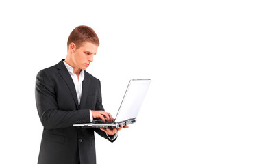 young businessman holding laptop