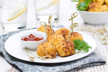 chicken meatballs in breading with tomato sauce