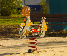 Sprung motorcycle at the playground
