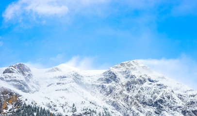 Fototapeta na wymiar Snow Drift on Mountain Peaks