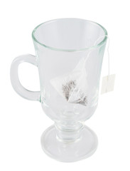Glass teacup with a tea bag inside