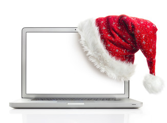 santa hat on laptop with clipping path - Powered by Adobe