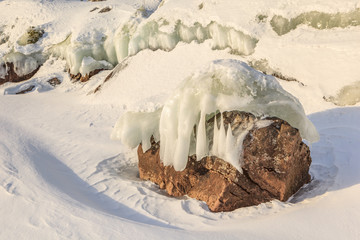 Winter, coast of the frozen lake.