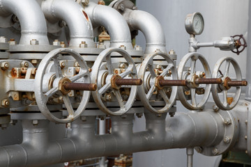 close-up of old gate valve on pipe connection