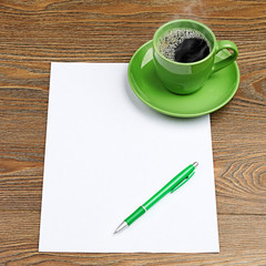 green coffee cup on white blank