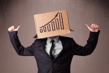Businessman gesturing with a cardboard box on his head with diag