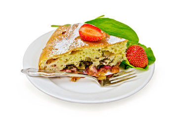 Pie with strawberry and sorrel on a plate with a fork