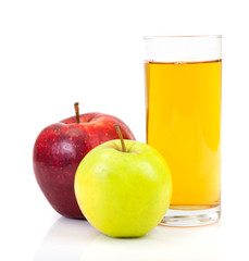 Delicious apple juice in glass and apples isolated on white