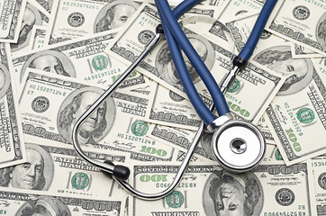 heap of dollars with stethoscope - 57691614