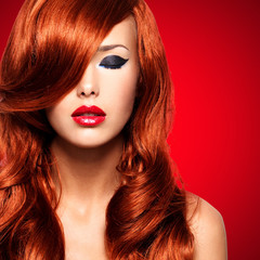 Portrait  of a  woman with long red hairs