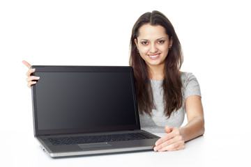 Young woman showing a laptop