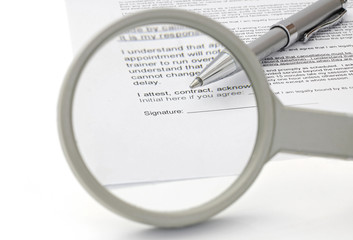 concept of good contract with magnifying Glass
