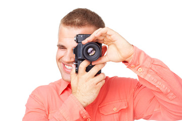 Young photographer taking pictures with his camera