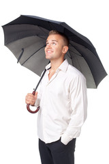 Happy young man under an umbrella