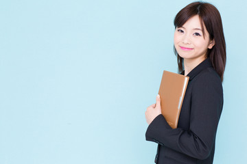 Obraz premium asian businesswoman on blue background