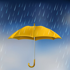 Yellow umbrella in rain