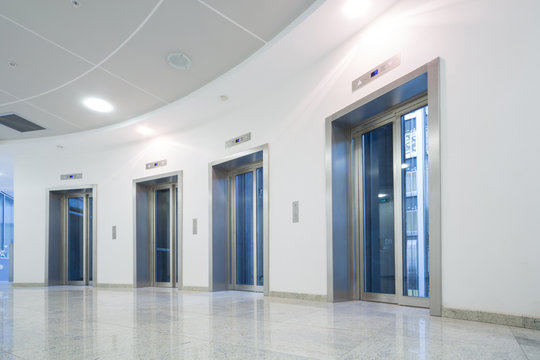 Four glass elevator door in the business building