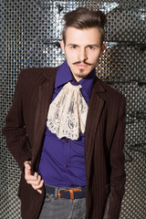 man with mustache in fashionable dress with lace tie